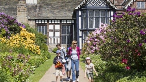 Visitors in the garden at Rufford Old Hall, Lancashire